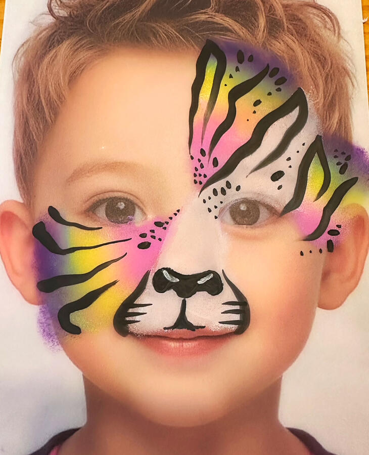 Rainbow Cheetah Face paint design for kids parties